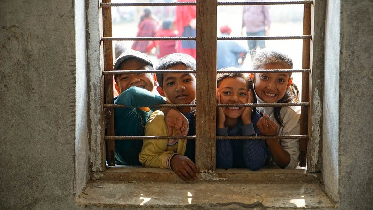 Children play outside a health event conducted by the group Mountain Heart Nepal in February 2018. Patients were seen by physicians inside a rural school in Seratar, a mountainous community eight hours outside of the capital city of Kathmandu. Residents in Seratar have limited access to regular health care, and Direct Relief supports the efforts of local groups, like Mountain Heart Nepal. (Dan Hovey/Direct Relief)