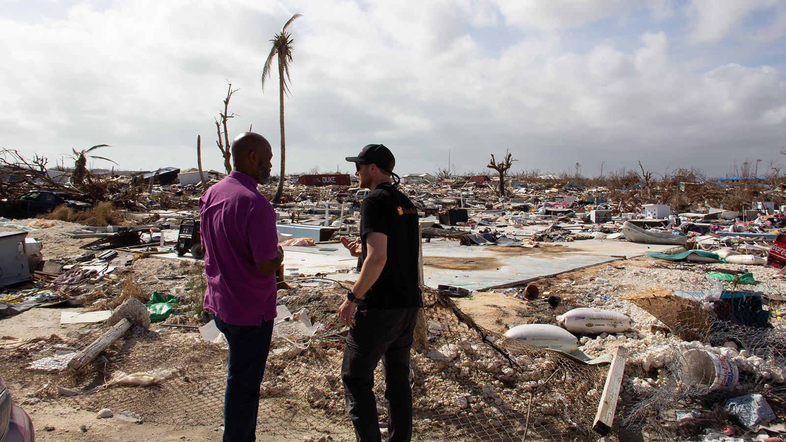 Delon Brennen, deputy chief medical officer with the Bahamas' Ministry of Health (left) and Direct Relief's Gordon Willcock on Abaco Island last week, as part of an effort with officials and medical staff from the University of Miami and the Bahamas' Ministry of Health to discuss partnerships for long-term recovery of the country's health system, post-Dorian. (Peter E. Howard/University of Miami)