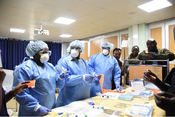 Dr. Asirwa training health care providers on proper cancer care delivery at the International Cancer Institute. (Photo Courtesy of Fredrick Chite Asirwa),