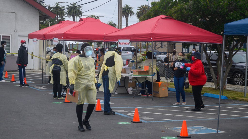 Health workers staff a San Jose, California temporary testing site. (Photo courtesy of Roots Community Clinic)