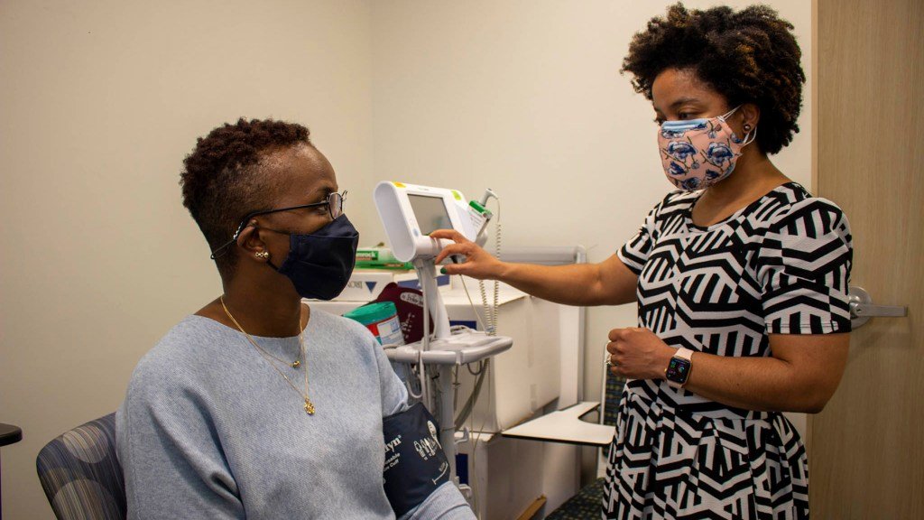 Pharmacist Rachel Rivera, right, began the Transitions of Care program in 2019. Beginning in 2020, she began helping Covid-19 patients who were released from the hospital. (Photo courtesy of Henry J. Austin Health Center)