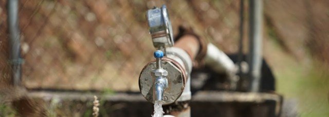 A water pump flows freely when powered by a set of solar panels and batteries in Bauta Abajo. The power system is one of two in the community, both of which are expected to be running this week. (Tony Morain/Direct Relief)